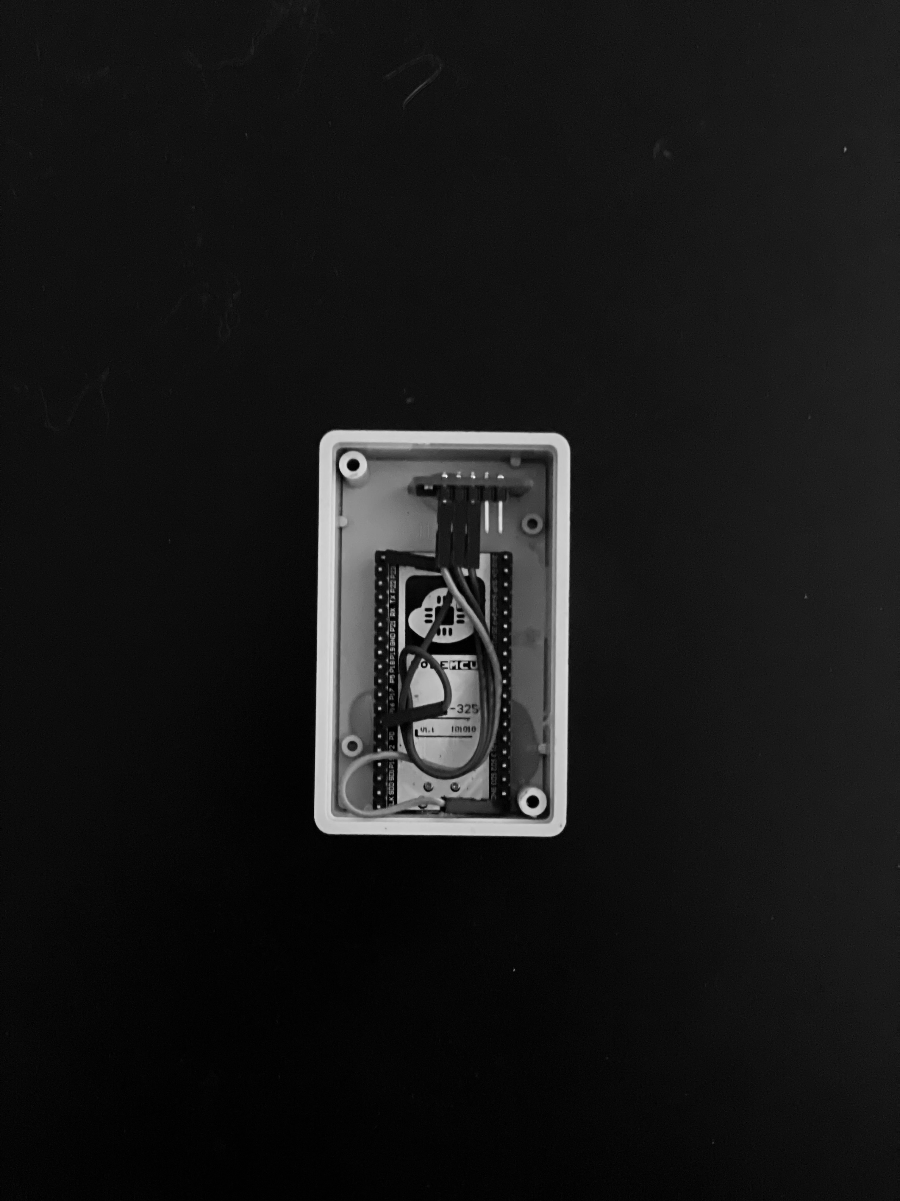 The open sensor box from above: the control board and the wiring.